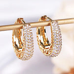 RAKOL Hollow Gold Color Hoop Earrings for Women Paved Dazzling CZ Stone Luxury Trendy Female Circle Earrings Statement Jewelry
